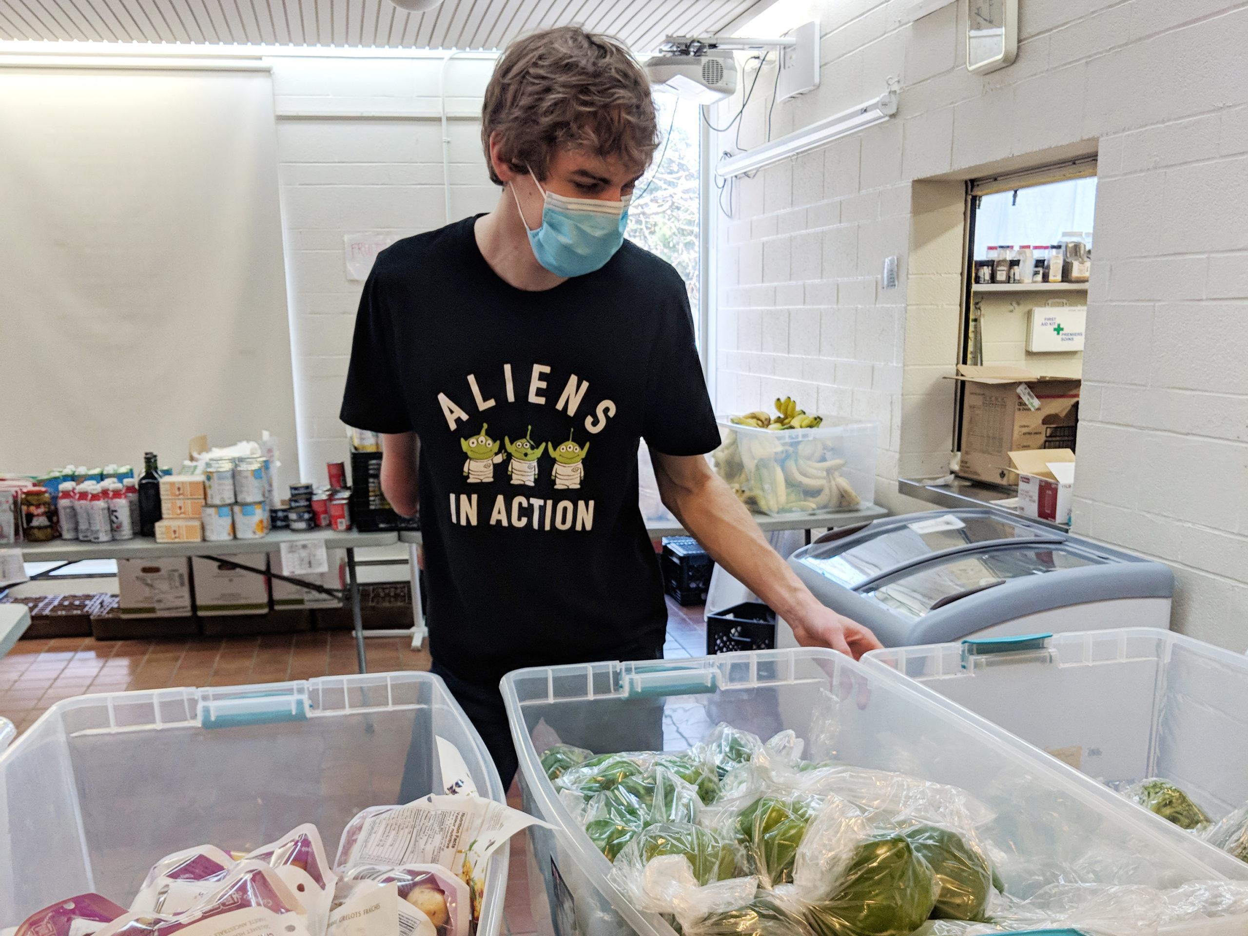 Jacob volunteering in food bank