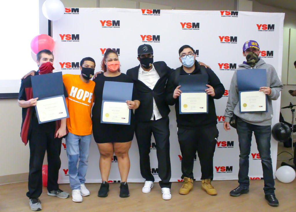 HOPE Graduates pose with their certificates while wearing face masks-fall 2020