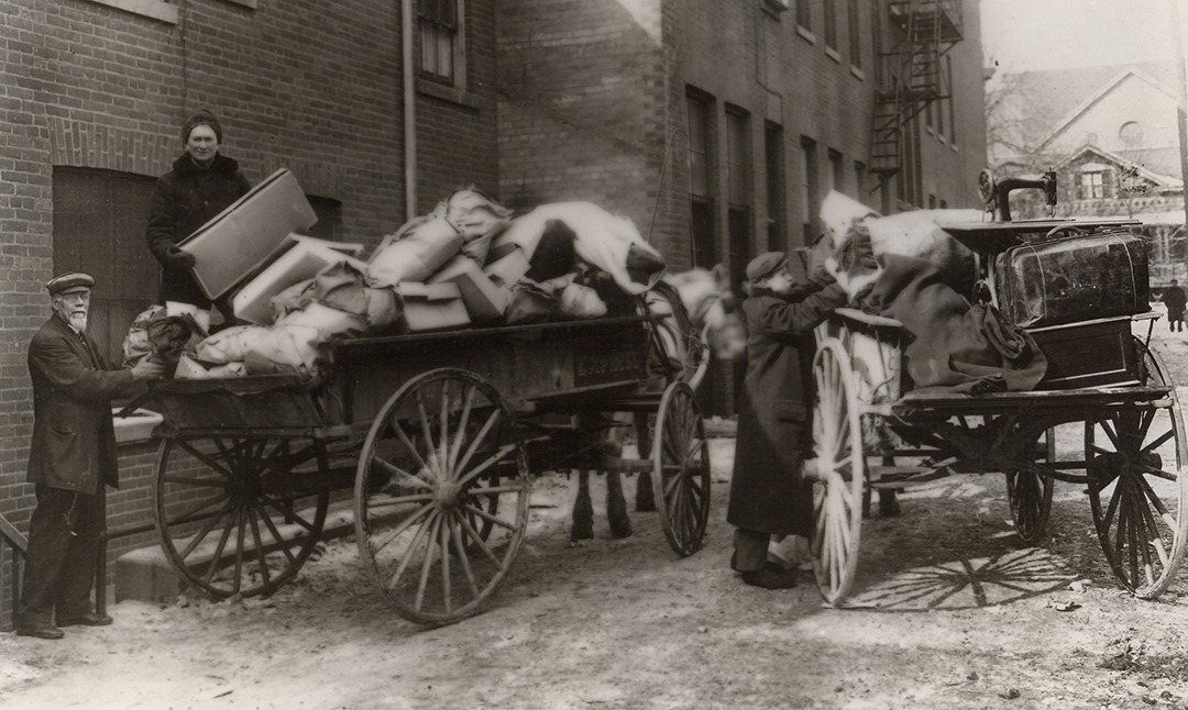 Donations being loaded into a wagon in 1896