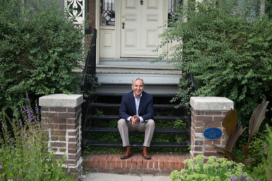 YSM staff Andrew on a porch