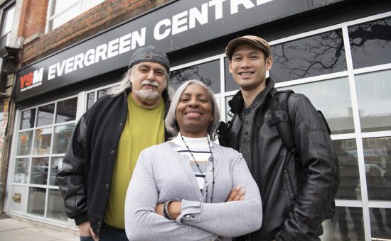three people in front of the evergreen centre
