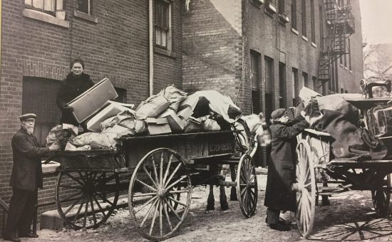 a black and white photo of an old cart 1896