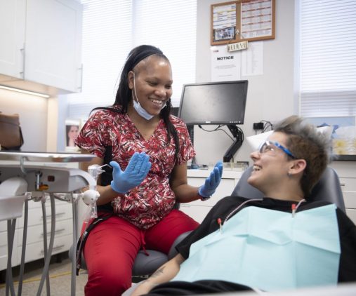 Dental care for homeless and street-involved youth. Dentist with a client in a chair