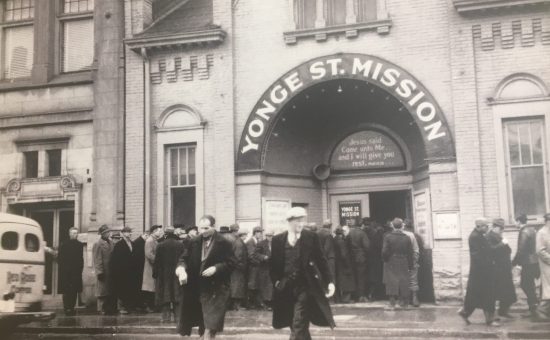 YSM building in 1930s, men waiting outside